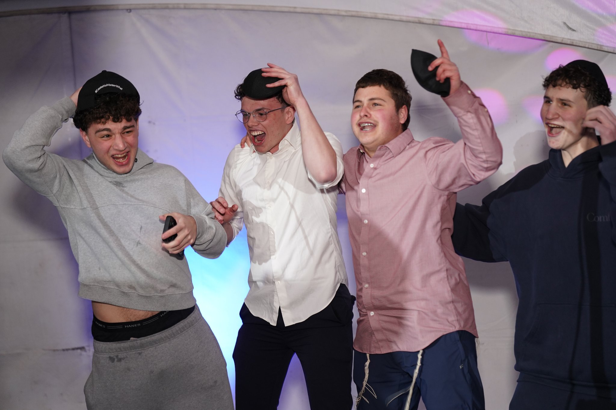 Teens celebrating and cheering at the Pesach Time Tours entertainment show