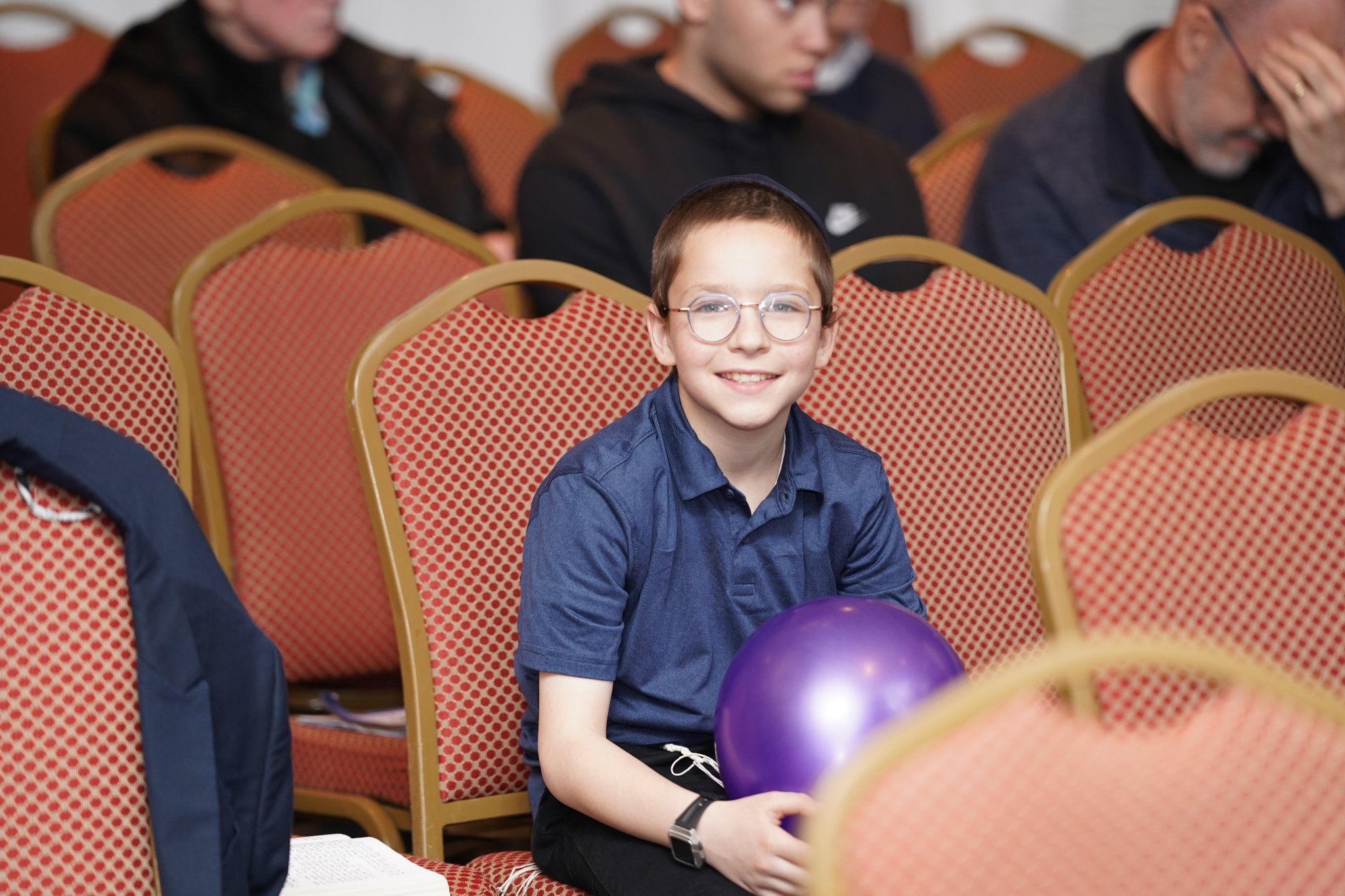 Boy with balloon at Pesach Time Tours show