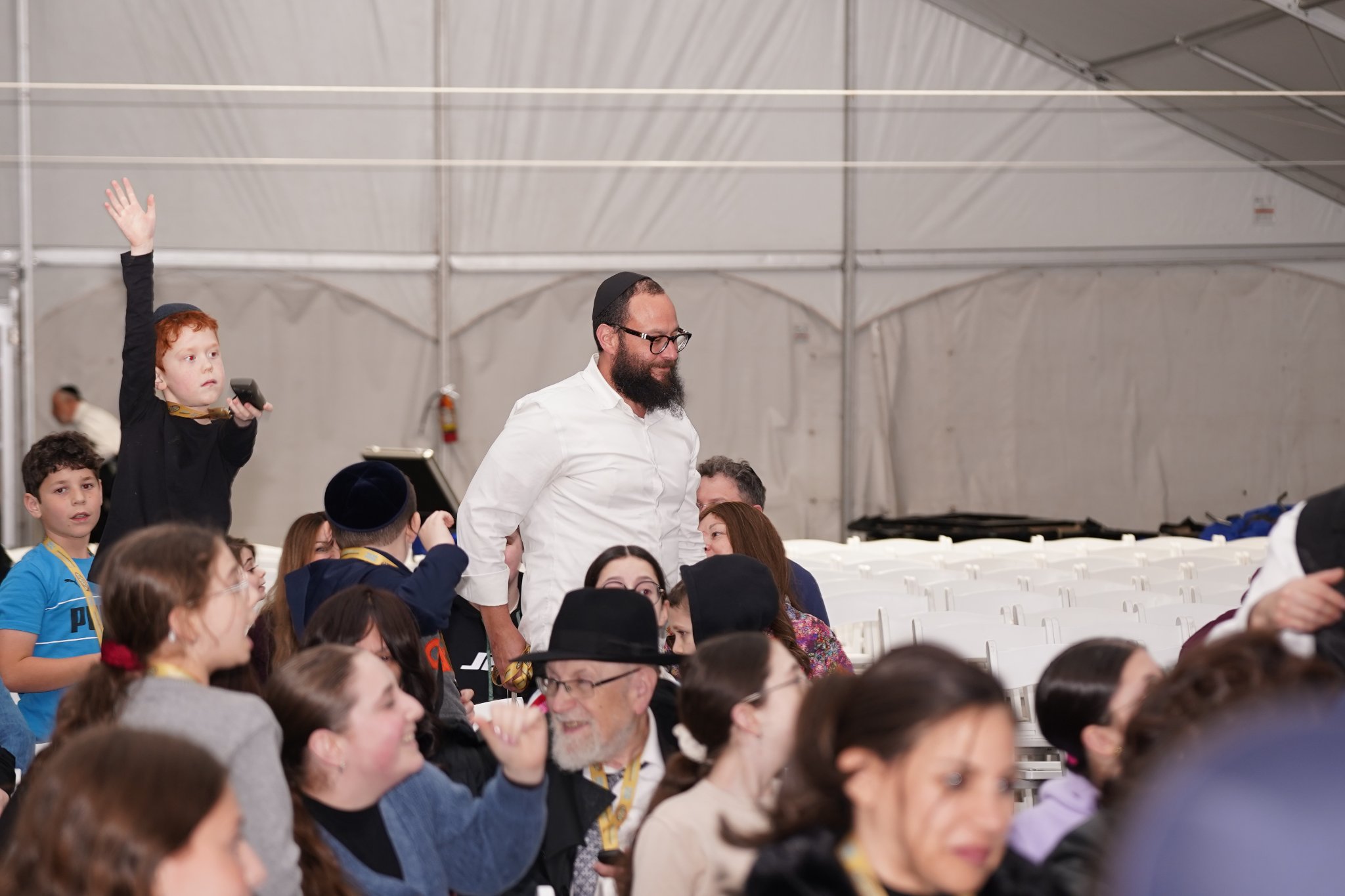 Crowd of families cheering at the Pesach Time Tours entertainment show