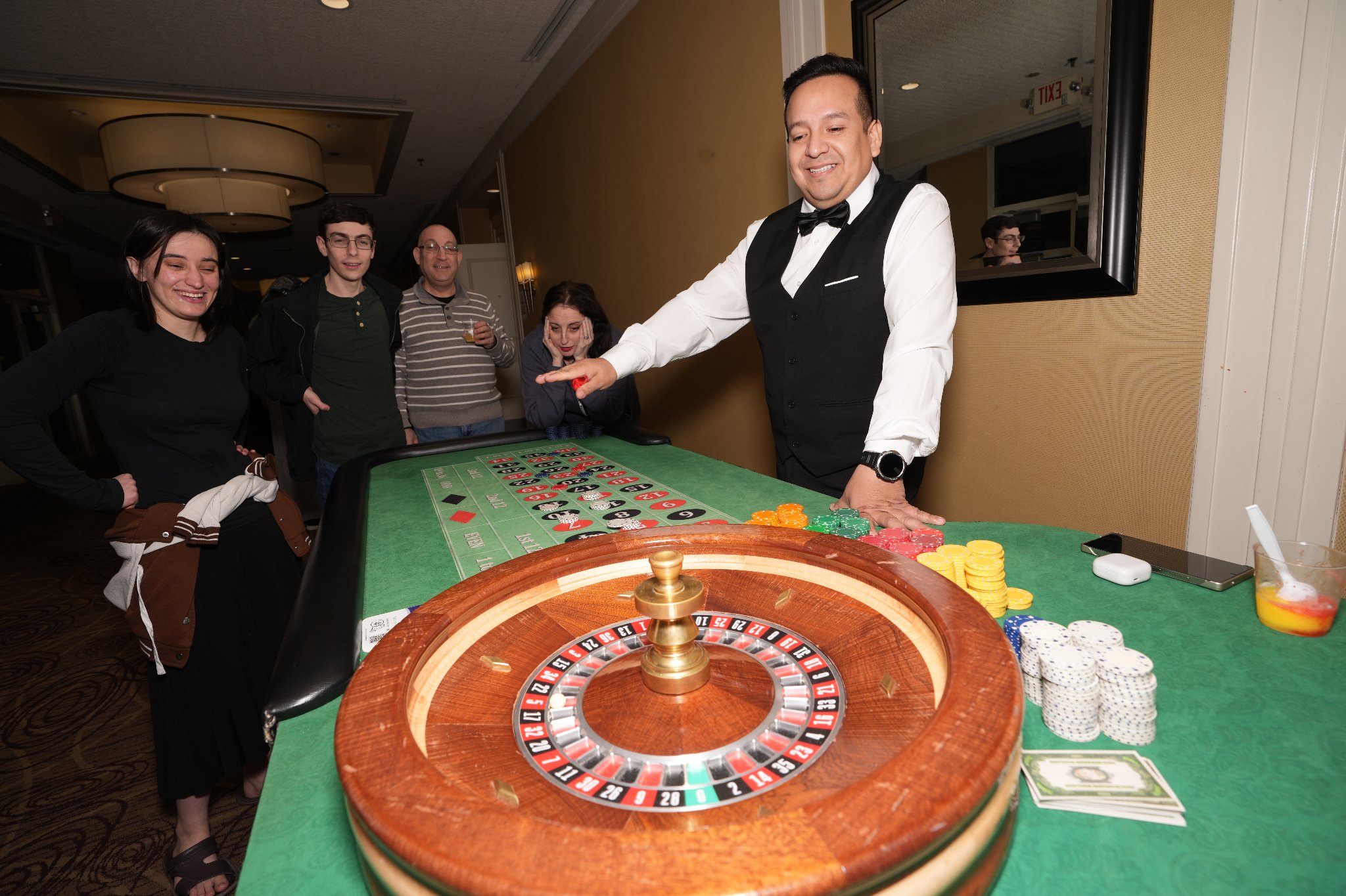 Guests at the roulette table at Pesach Time Tours casino night